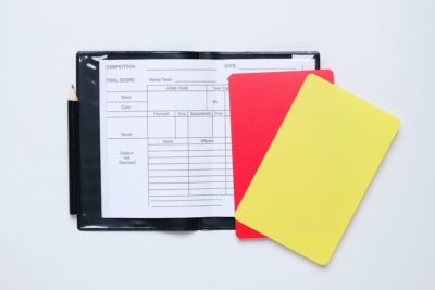Red and yellow cards with a clipboard
