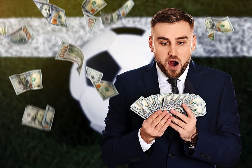 Football player holding money