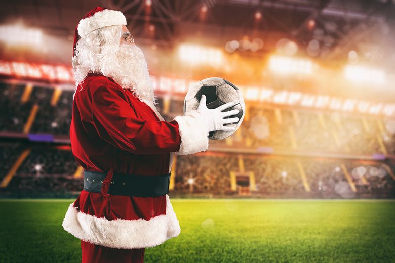 Santa Claus holding football