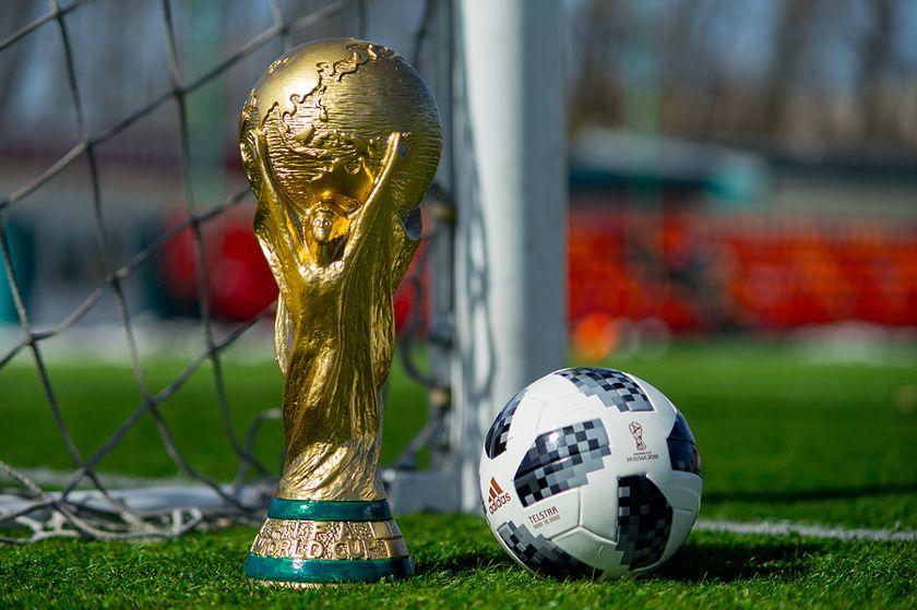 World Cup Trophy Next to Ball
