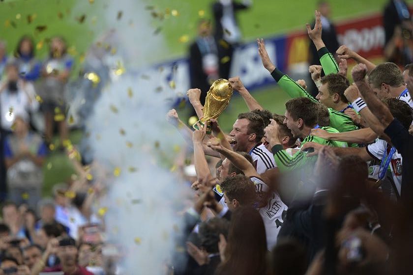 World Cup fans holding trophy