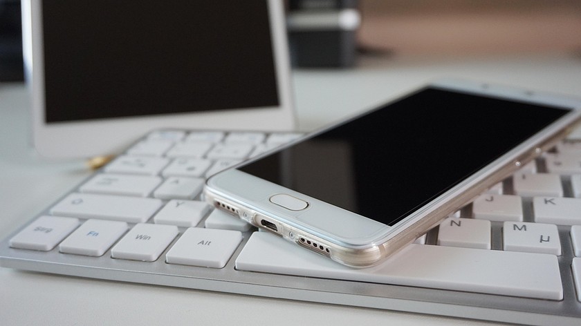 White Smartphone Tablet and Keyboard