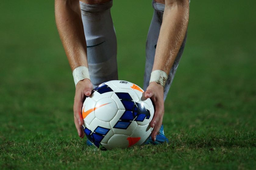 Holding football for penalty shot