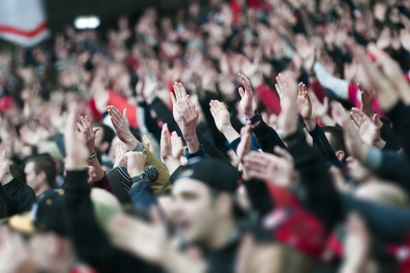 Football Fans Clapping in Stadium
