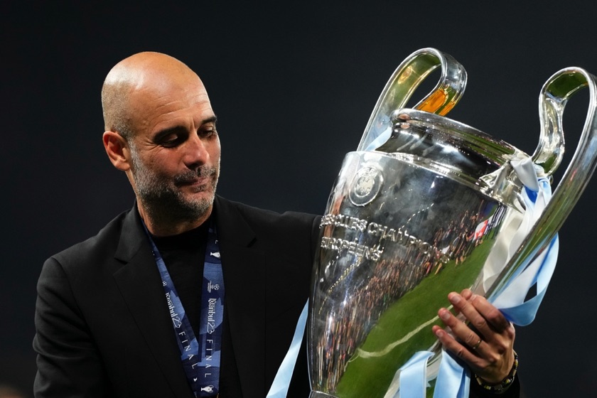 Pep Guardiola holding a trophy