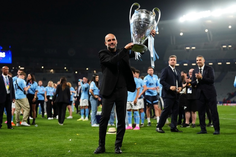 Pep Guardiola lifting trophy
